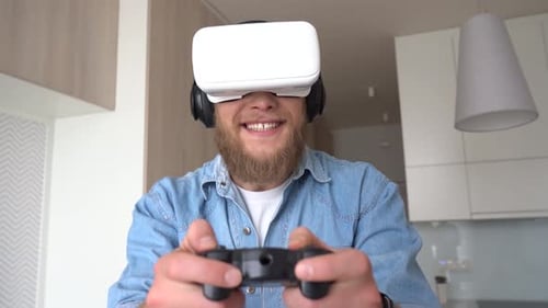 Man wearing VR headset playing video game