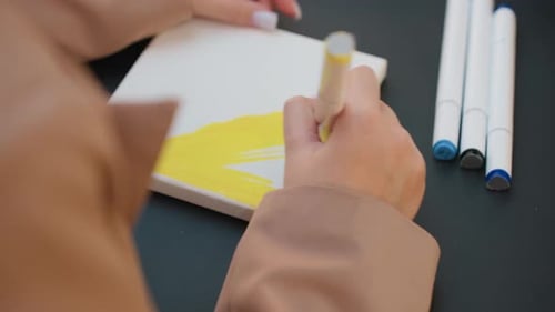 Yellow Color Fill on Small Canvas Caucasian Illustrator Applies Bold Marker Strokes for Color Block
