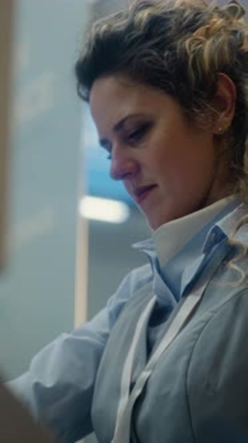 Airport Checkin Counter Female Airline Agent Checking Boarding Documents of Passenger
