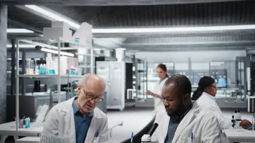 Scientists Working Together in Modern Research Laboratory
