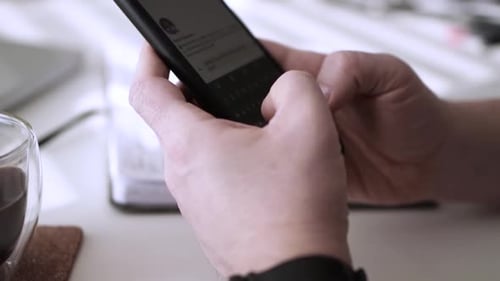 Man scrolling social media in smartphone