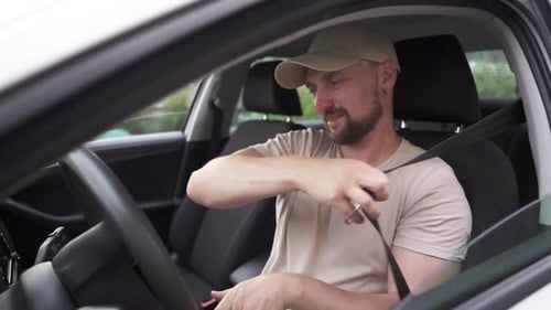 Male Hand Gives a Car Keys to Male Hand in the Car Dealership Close Up