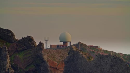 Building with Dome on Mountain at Sunset