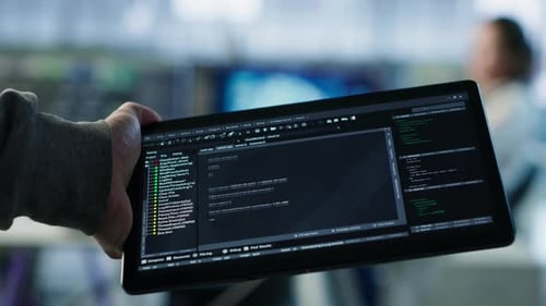 Computer Scientist in Data Center Solving Tasks on Tablet