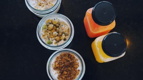Overhead View of Jars of Granola and Juice