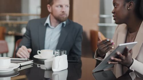 Black Woman Working With Business Partners