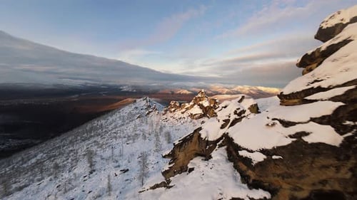Snowy Mountains Aerial View at Sunrise or Sunset