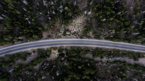 Rotating Aerial top bird's eye drone shot of a small canyon highway in the Uinta Wasatch Cache Natio