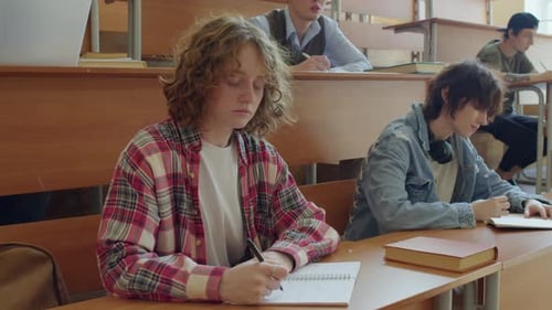 Students Taking Notes in a University Classroom