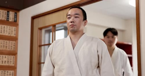 Two Men Wearing Martial Arts Uniforms