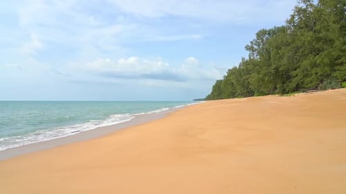 Waves crashing on deserted beach. Slow-motion