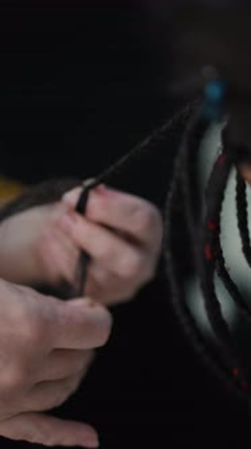 Professional Hairstylist Slowly Braiding Dark Hair