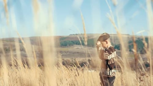 Rural Boy in a Field on a Hill Running