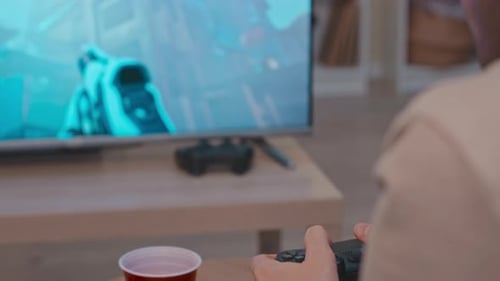 Man Playing Video Game at Home