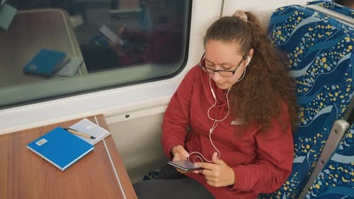 Woman with Notebook Lady Focuses on Writing Notes While Observing Passing Scenery Passenger Engaged