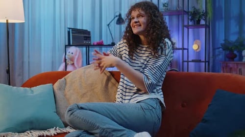 Animated Woman Gesturing on Sofa at Home