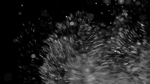 Sparkling White Dust Particles Floating on a Black Background