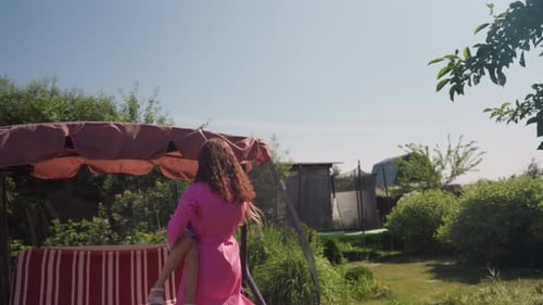 Serene Outdoor Repose Solitary Woman Enjoying Peaceful Garden Moment Tranquil Image Of Woman