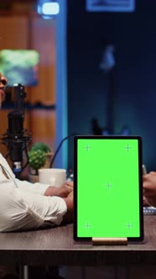 Vertical Video Chroma Key Tablet Next to Talking Show Interviewer Telling Jokes to Audience Watching