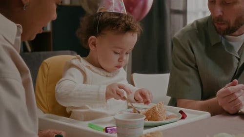Family Celebrates Adorable Baby's First Birthday Indoors