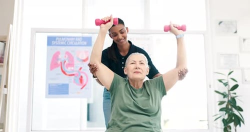Rehabilitation Exercise with Dumbbells in Therapy Setting