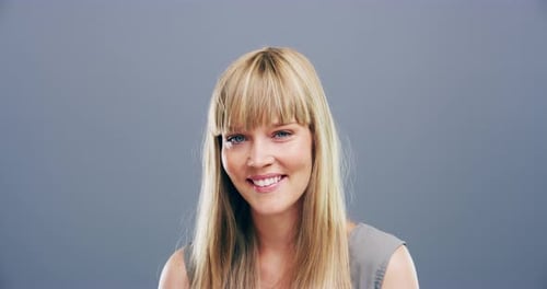 Smiling Woman Close Up on Grey Background