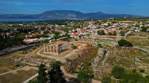 Aerial view of ancient ruins in Greece, with a clear view of the surrounding landscape and historica