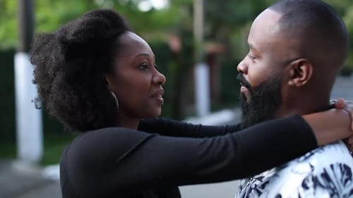 Loving Couple Embracing Outdoors on a Sunny Day
