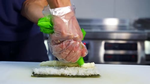 Making sushi at restaurant. The process of making sushi and rolls