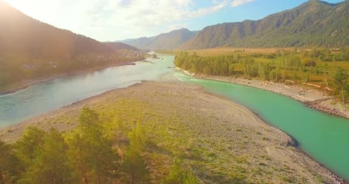Low Altitude Flight Over Fresh Fast Mountain River with Rocks at Sunny Summer Morning