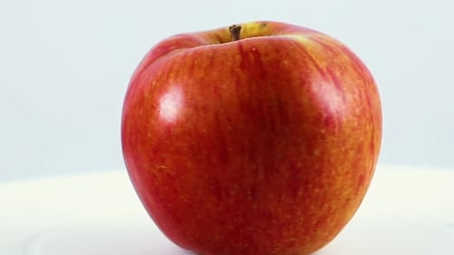 Ripe Apple Slowly Rotates in Circle