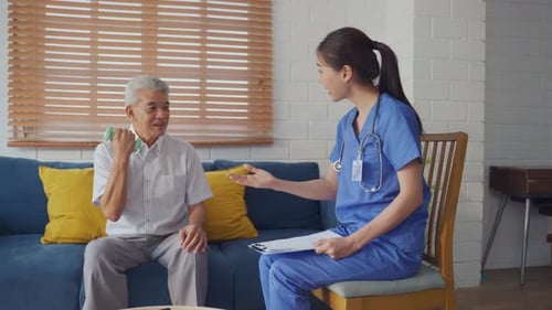 Senior Man Exercising with Physical Therapist at Home