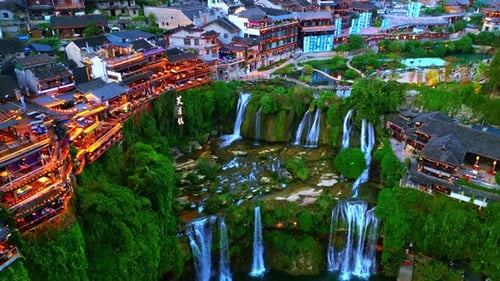 Aerial view of waterfalls and houses, China.
