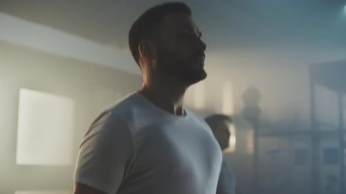 Men Exercising by Jumping Rope in Gym