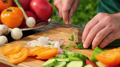 Chopping Fresh Vegetables for a Healthy Outdoor Salad