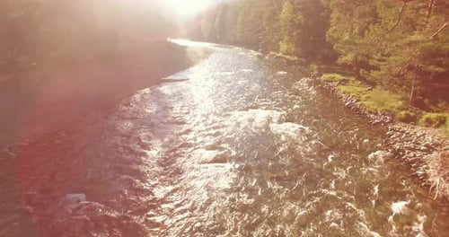 Low Altitude Flight Over Fresh Fast Mountain River with Rocks at Sunny Summer Morning