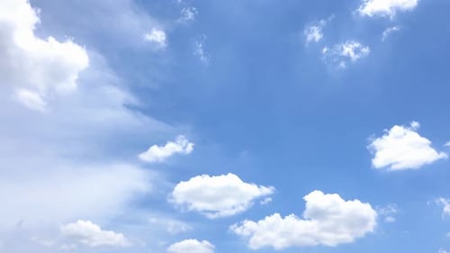 White Clouds Float Gently in a Blue Sky