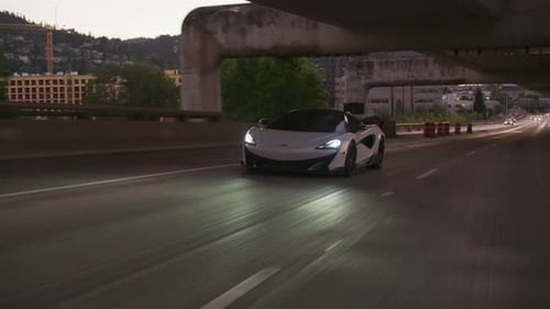Portland Oregon mclaren supercar drives on city street circa 2020