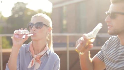 Friends Drinking and Enjoying the Sunshine Together