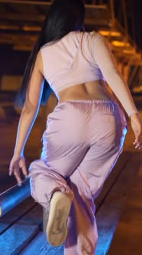 Trap Artist Dancing on a Park Table at Night