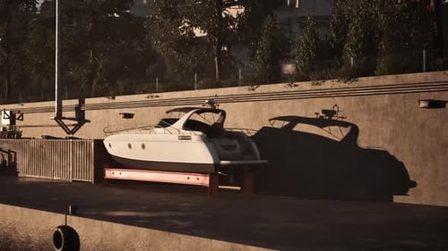 A Sleek Boat Resting on a Dock in a Serene Marina During Golden Hour