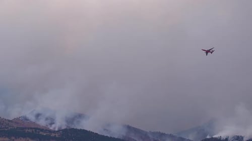 Water bomber plane flying over the Calwood fire in Northern Colorado - 10.17.2020