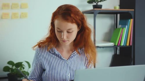Beautiful Young Businesswoman Use Laptop Look at Monitor at Office Speaking Computer Workplace