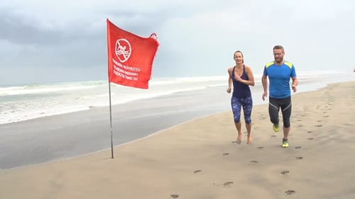 Sportive Couple Jogging On Beach, Super Slow Motion 240fps