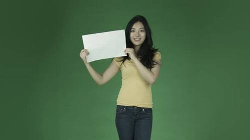 Attractive woman from east asia in her 20s isolated in studio