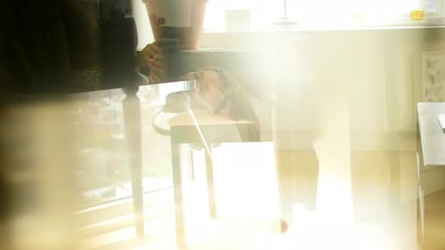 Young Woman Relaxing on Couch Using Smartphone