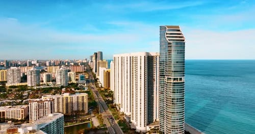 Approaching high-rise architecture on the shore of the Atlantic Ocean. View of Miami Beach