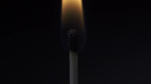 Matchstick Igniting with Fire and Warm Glow