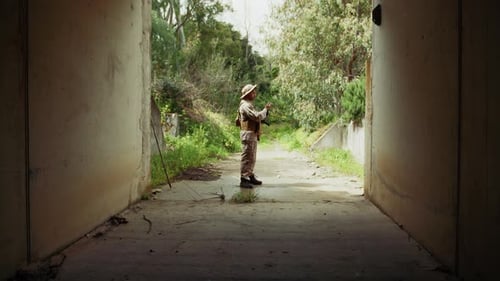 Soldier Stands Guard Wearing Camouflage Holding Firearm