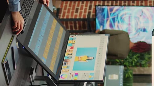 Person Editing Photos Using Graphic Design Software